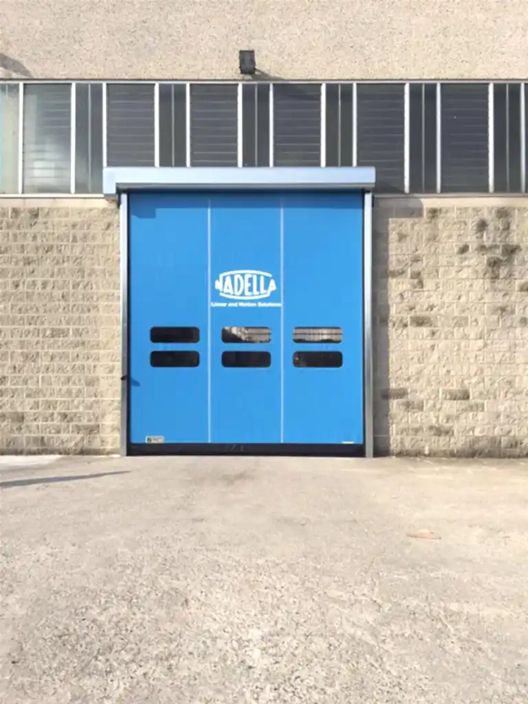 DynamicRoll High Speed Roll Up Doors with blue curtain and personalized logo